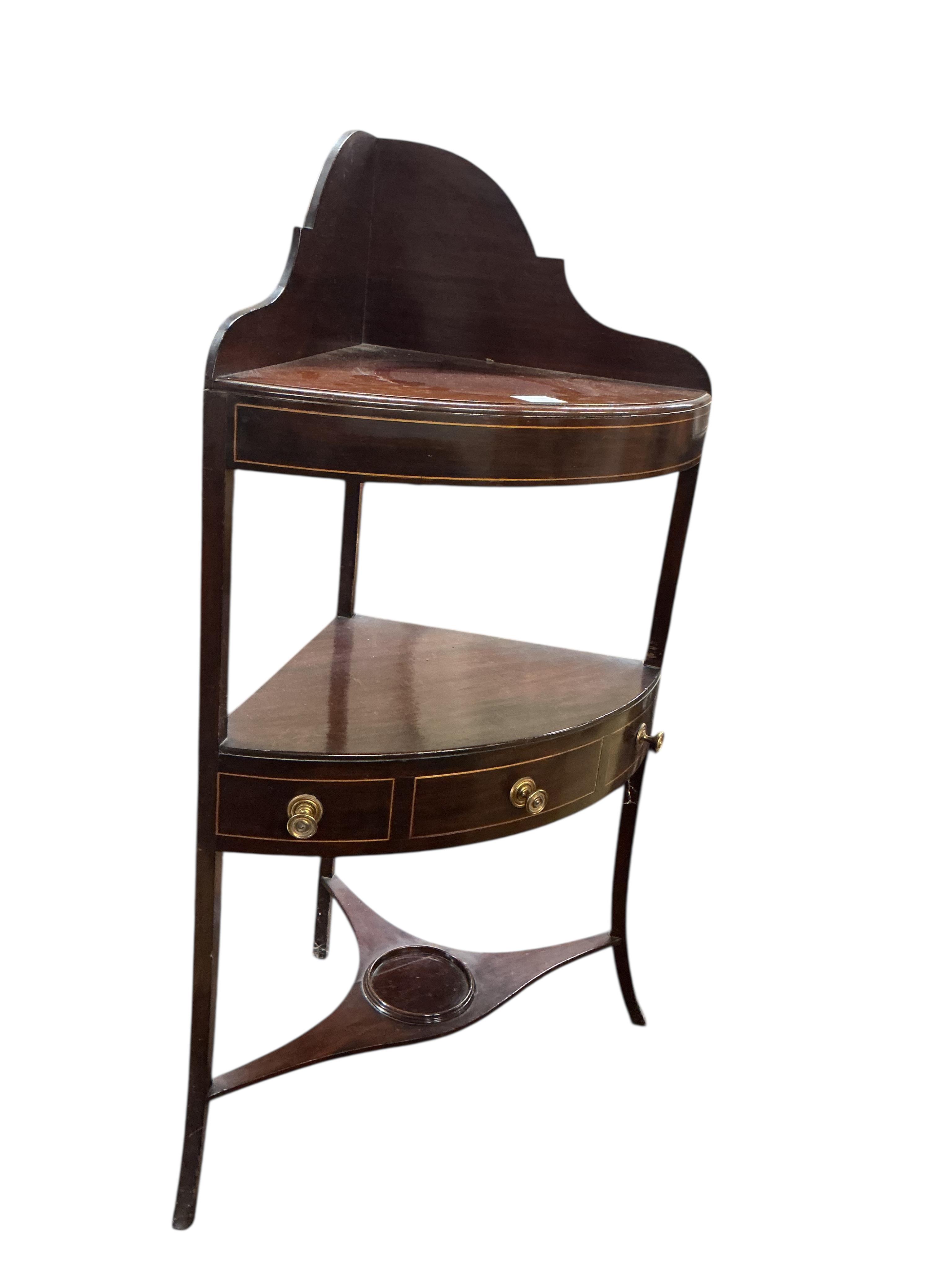 A George III inlaid mahogany bow fronted corner washstand, width 56cm, depth 37cm, height 103cm
